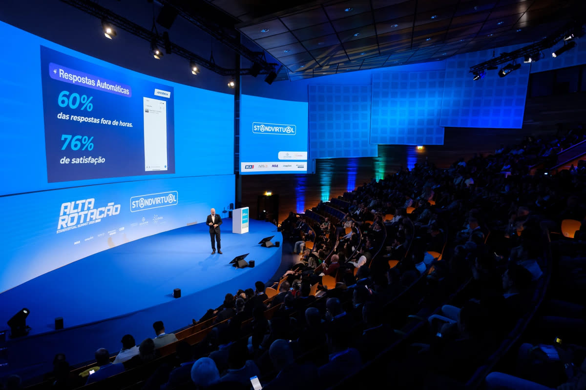 A speaker presenting product results to the auditorium